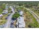 Scenic aerial view of a condo community with lush landscaping, palm trees and ample parking space at 124 Golden Eye Dr # A, Daytona Beach, FL 32119