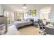 Bright bedroom featuring a comfortable bed, modern decor, and an adjacent bathroom at 124 Golden Eye Dr # A, Daytona Beach, FL 32119