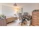 Cozy bedroom featuring neutral tones, comfortable bed, and functional workspace with modern desk at 124 Golden Eye Dr # A, Daytona Beach, FL 32119