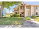 Inviting two-story townhouse with stone details, manicured lawn, and a cozy, welcoming entrance at 124 Golden Eye Dr # A, Daytona Beach, FL 32119