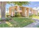 Charming two-story townhouse with stone accents and well-maintained landscaping on a sunny day at 124 Golden Eye Dr # A, Daytona Beach, FL 32119