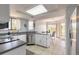 Bright kitchen with stainless steel appliances, a breakfast bar, and a view to the dining area at 124 Golden Eye Dr # A, Daytona Beach, FL 32119