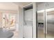 A compact laundry closet with a stacked washer and dryer, conveniently located near the kitchen at 124 Golden Eye Dr # A, Daytona Beach, FL 32119