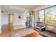 Bright living room with a large window, stylish shelving, and comfortable seating at 124 Golden Eye Dr # A, Daytona Beach, FL 32119