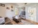 Comfortable living room with a media center, a plush sofa, and a glimpse into the kitchen at 124 Golden Eye Dr # A, Daytona Beach, FL 32119