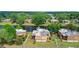 Aerial view of townhomes in a community with a pond, showcasing the layout and surrounding greenery at 135 Moonstone Ct, Port Orange, FL 32129