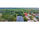 Picturesque aerial view of townhome community by a pond and green landscape, showing the property's prime location at 135 Moonstone Ct, Port Orange, FL 32129
