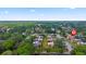 Aerial view of the property surrounded by lush greenery and other residences in the neighborhood at 135 Moonstone Ct, Port Orange, FL 32129