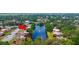 Aerial view showcasing the community with a picturesque pond and lush landscaping at 135 Moonstone Ct, Port Orange, FL 32129