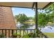 A relaxing view from the outdoor balcony overlooking a scenic pond with a fountain at 135 Moonstone Ct, Port Orange, FL 32129