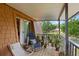 Large outdoor balcony with furniture, plants, and beautiful view of the adjacent pond at 135 Moonstone Ct, Port Orange, FL 32129