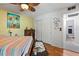 Comfortable bedroom with wood floors and closet, with an en suite bathroom access at 135 Moonstone Ct, Port Orange, FL 32129