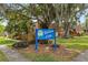 Willow Lake community sign surrounded by mature landscaping and lush green grass at 135 Moonstone Ct, Port Orange, FL 32129