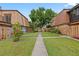 Exterior courtyard view with a sidewalk and well-maintained landscaping at 135 Moonstone Ct, Port Orange, FL 32129