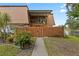 Exterior shot with water view, a second story patio, and mature landscaping at 135 Moonstone Ct, Port Orange, FL 32129