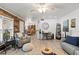Open-concept living room with hardwood floors and seamlessly blends into the dining area, providing ample space for entertaining at 135 Moonstone Ct, Port Orange, FL 32129