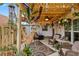 Charming patio with comfortable seating, string lights, and decorative elements creating a cozy outdoor retreat at 135 Moonstone Ct, Port Orange, FL 32129