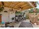 Cozy patio with a variety of potted plants, furniture, and decorative lighting at 135 Moonstone Ct, Port Orange, FL 32129