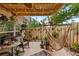 Relaxing outdoor patio featuring a hammock chair, lush greenery, and a privacy fence, perfect for unwinding at 135 Moonstone Ct, Port Orange, FL 32129