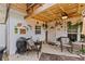 Cozy outdoor patio with string lights, comfortable seating, and decorative accents creating a welcoming space at 135 Moonstone Ct, Port Orange, FL 32129