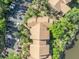 An aerial view shows the top of this multi-Gathering home nestled among trees and parking at 1401 S Palmetto Ave # 300, Daytona Beach, FL 32114