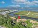 An aerial view with a pin highlights this multi-Gathering home nestled among lush trees, with water views and parking at 1401 S Palmetto Ave # 300, Daytona Beach, FL 32114