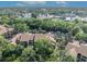 An aerial view shows this property nestled among lush trees with ample parking spaces at 1401 S Palmetto Ave # 300, Daytona Beach, FL 32114