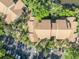 An aerial view shows the top of this multi-Gathering home nestled among trees and parking at 1401 S Palmetto Ave # 300, Daytona Beach, FL 32114