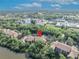 Overhead shot of a condo building in a lush, green community with a red map marker indicating the location at 1401 S Palmetto Ave # 300, Daytona Beach, FL 32114