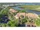 An aerial view showcases this multi-Gathering home nestled among lush trees, with water views and parking at 1401 S Palmetto Ave # 300, Daytona Beach, FL 32114