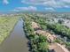 Scenic aerial image shows waterfront property and lush green landscaping along a serene river at 1401 S Palmetto Ave # 300, Daytona Beach, FL 32114