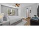 Bedroom features a large window, a ceiling fan, a bed, and a closet at 1401 S Palmetto Ave # 300, Daytona Beach, FL 32114