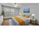 Bedroom features a bed, a window, and lamps at 1401 S Palmetto Ave # 300, Daytona Beach, FL 32114
