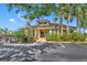 Charming community clubhouse surrounded by lush landscaping and ample parking at 1401 S Palmetto Ave # 300, Daytona Beach, FL 32114