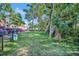 Community dog park with lush green grass and shady trees, perfect for pet owners at 1401 S Palmetto Ave # 300, Daytona Beach, FL 32114