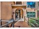 Charming condo building entrance with arched entryway and wooden walkway at 1401 S Palmetto Ave # 300, Daytona Beach, FL 32114