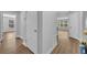Bright hallway with laminate floors and multiple doorways at 1401 S Palmetto Ave # 300, Daytona Beach, FL 32114