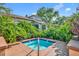 Secluded backyard hot tub surrounded by lush greenery and beautiful landscaping at 1401 S Palmetto Ave # 300, Daytona Beach, FL 32114