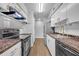 Modern kitchen with stainless steel appliances, granite countertops, and white cabinets at 1401 S Palmetto Ave # 300, Daytona Beach, FL 32114