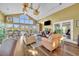 Spacious living room with large windows, vaulted ceiling, and comfortable seating at 1401 S Palmetto Ave # 300, Daytona Beach, FL 32114