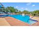 Sparkling community pool featuring comfortable lounge chairs and lush landscaping at 1401 S Palmetto Ave # 300, Daytona Beach, FL 32114