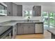 Well-lit kitchen with stainless steel appliances, granite countertops, and a view to the backyard at 1427 18Th St, Orange City, FL 32763