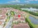 Community aerial view showcases the community's layout near the lake and surrounding greenery at 1436 Lobelia Dr, Lake Mary, FL 32746