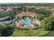 Aerial view of the community clubhouse, pool, and surrounding lush landscaping at 1436 Lobelia Dr, Lake Mary, FL 32746