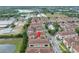 Overhead view of townhomes with tiled roofs, lush landscaping, and street layout; location highlighted at 1436 Lobelia Dr, Lake Mary, FL 32746