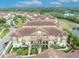 Scenic aerial view showcases the community's tile roofs, landscaping, and lakeside setting at 1436 Lobelia Dr, Lake Mary, FL 32746