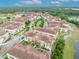 This aerial view showcases a vibrant community nestled near a lake with scenic landscapes at 1436 Lobelia Dr, Lake Mary, FL 32746
