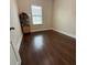Bright bedroom featuring hardwood floors and a window at 1436 Lobelia Dr, Lake Mary, FL 32746