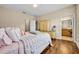 Bedroom with wood floors, closet, and ensuite bathroom access at 1436 Lobelia Dr, Lake Mary, FL 32746