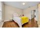 Bedroom showcases a comfortable bed, soft lighting, wood floors, and a welcoming atmosphere at 1436 Lobelia Dr, Lake Mary, FL 32746